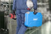 Engineer Carrying SKF bearing puller with SKF branded carry box