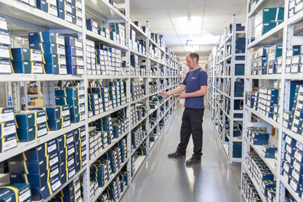 Man picking bearings in Acorn warehouse