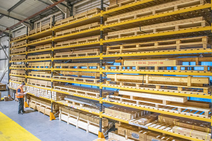 Man looking at linear products in Acorn warehouse