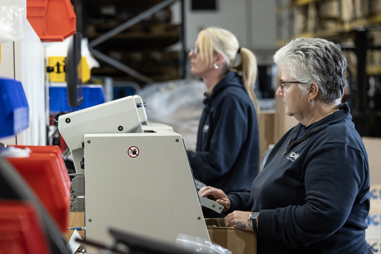 Warehouse operatives printing labels