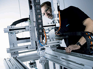 Engineer inspecting a modular machine automation system