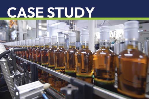 Whiskey bottles being transported along a production line