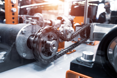 Industrial chain running at speed around sprokets