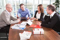 Business discussion around a table
