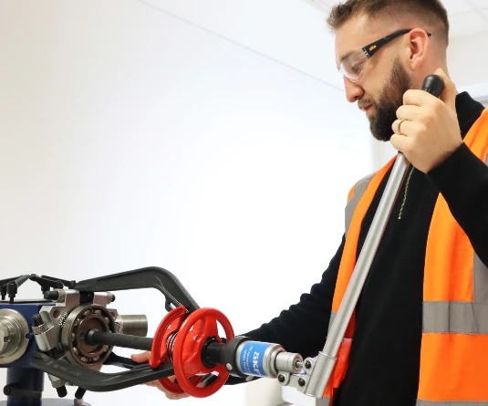 Man using bearing pullers
