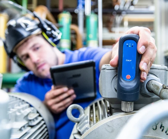 Man using condition monitoring equipment