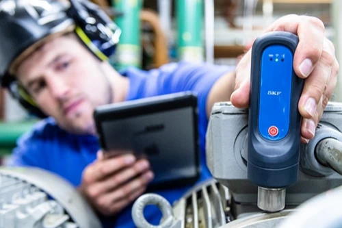 Man using condition monitoring equipment