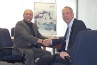 iwis managing director Andrew Fletcher and Acorn PT product manager celebrate the new partnership